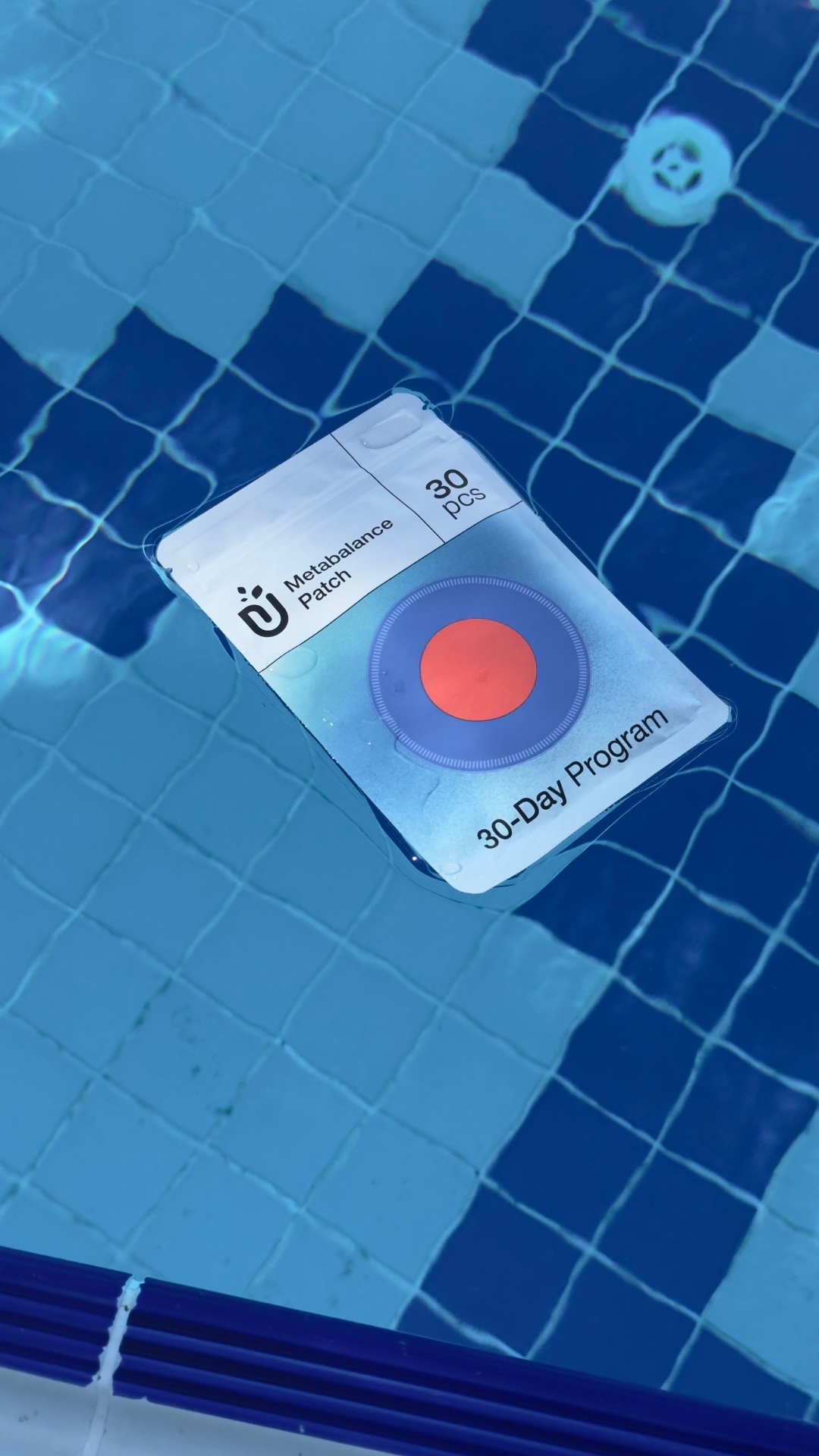 Purisaki patch pouch floating in a swimming pool, showing it's waterproof